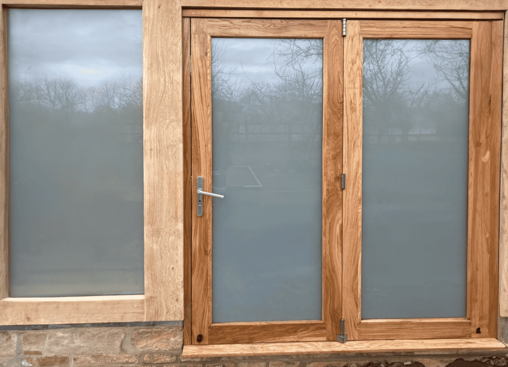 Lead oak door in a set of sliding folding doors