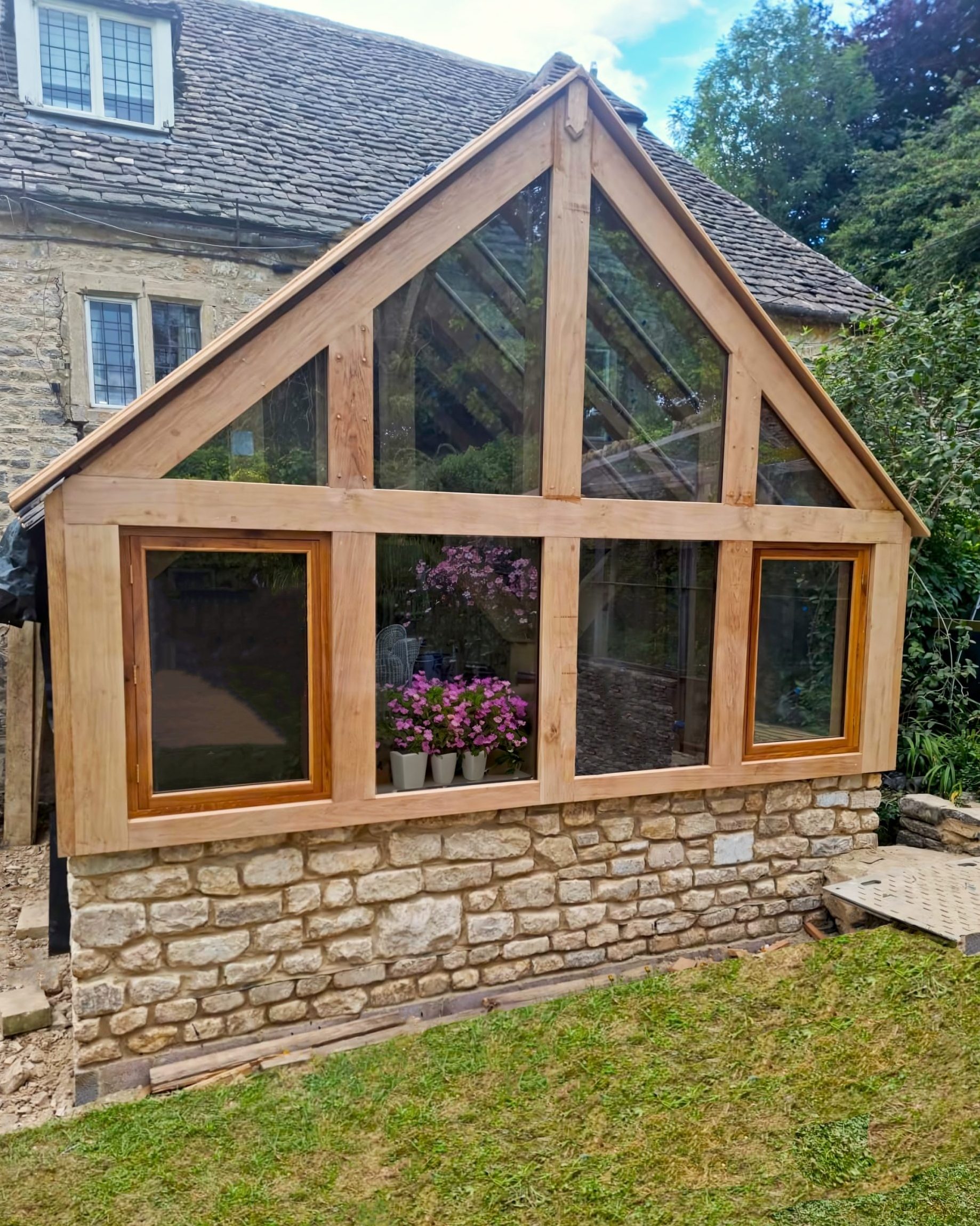 OAK Tow opening windows on a greenhouse frame, on a fully glazed gable